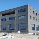 Neubau der Werkhalle und der Bürogebäude.